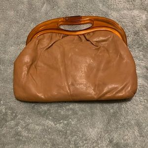 Ward’s faux leather brown clutch with amber plastic handle